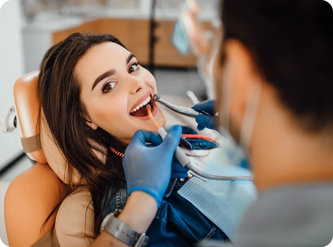 Woman being examined by the dentist