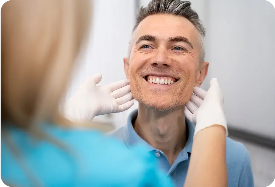 Man showing teeth to dentist