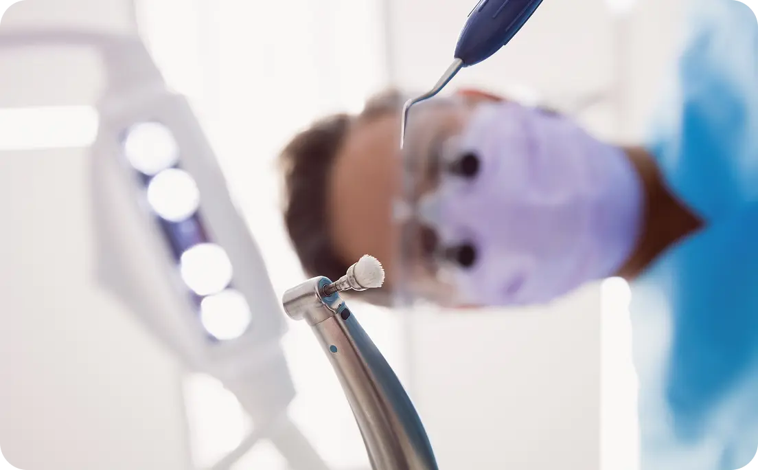 Dentist examining patient