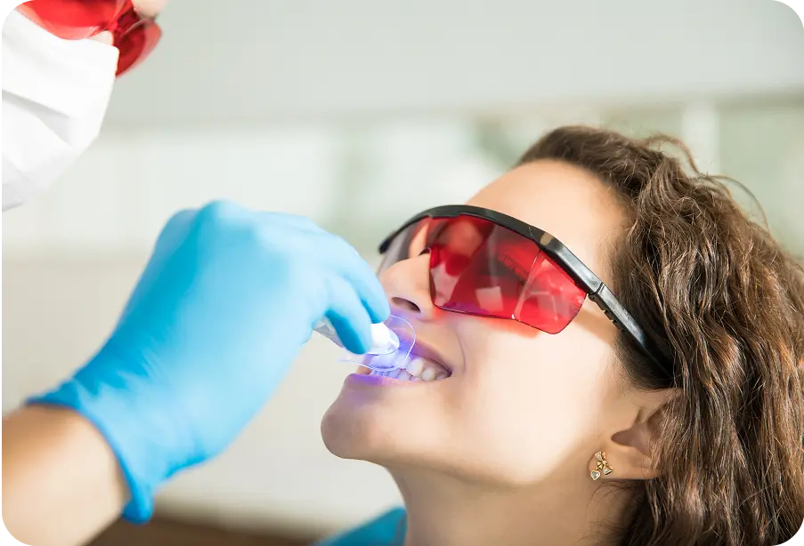 Woman doing Pola teeth whitening