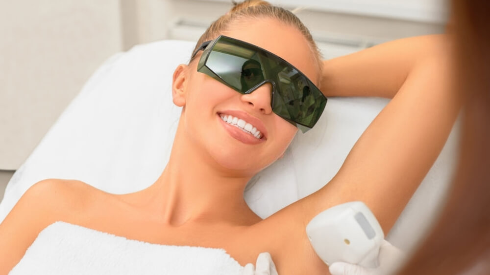 a woman is happy with IPL treatment