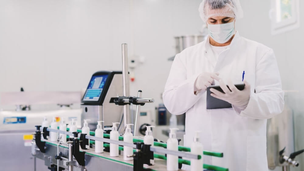 A man controlling production line on chemical sunscreen