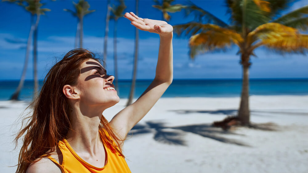 Woman is trying avoid exposure to sunlight