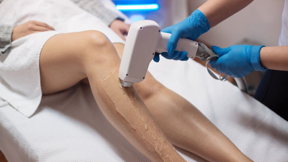 Beautician removing hair with laser