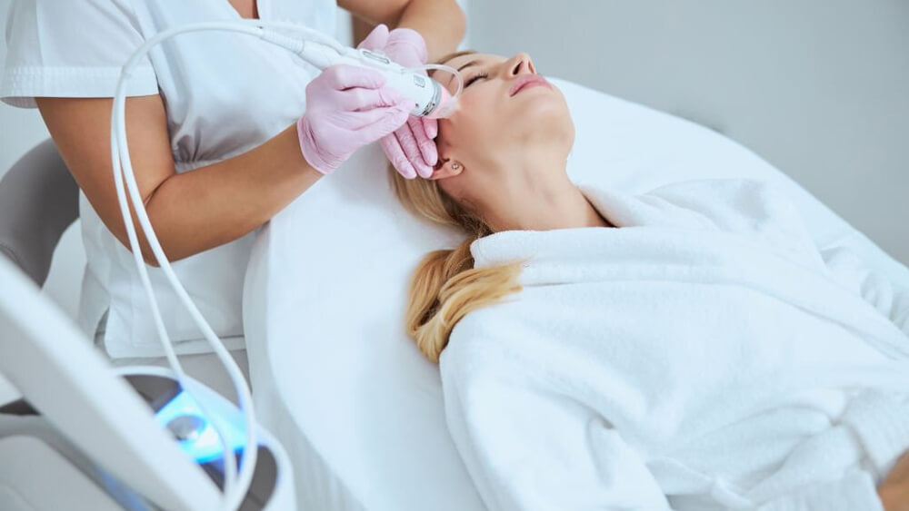 Blonde woman getting a microneedling