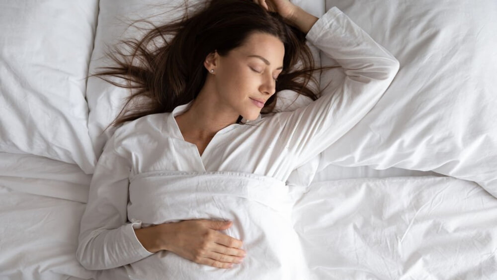 Beautiful lady sleeping in the cozy bed