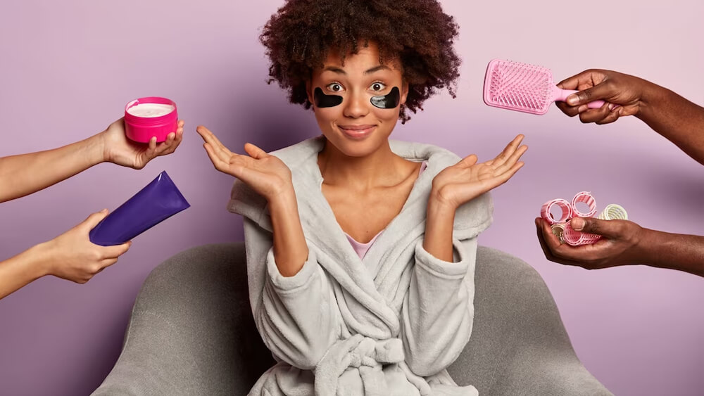 Curly haired woman bathrobe deciding on cosmetics