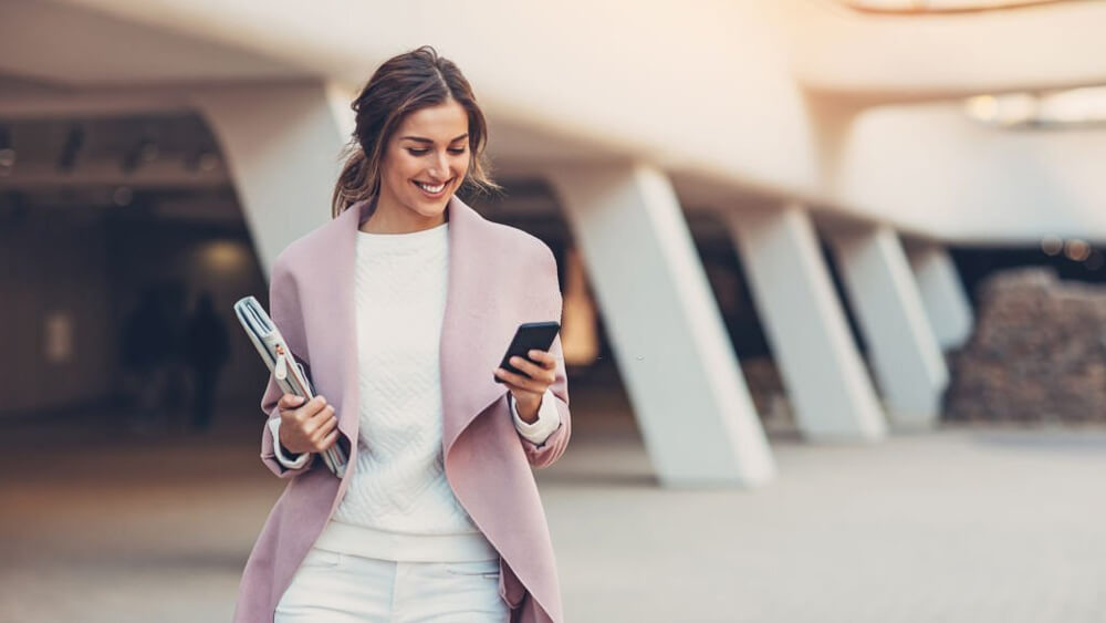 Fashionable woman with smart phone