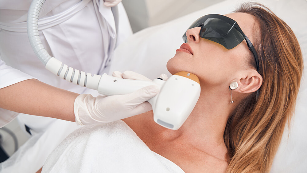 Calm female during IPL treatment on her face