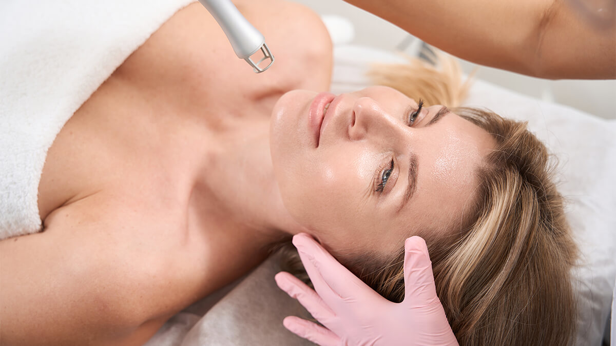 Top view of lady under laser skin resurfacing procedure