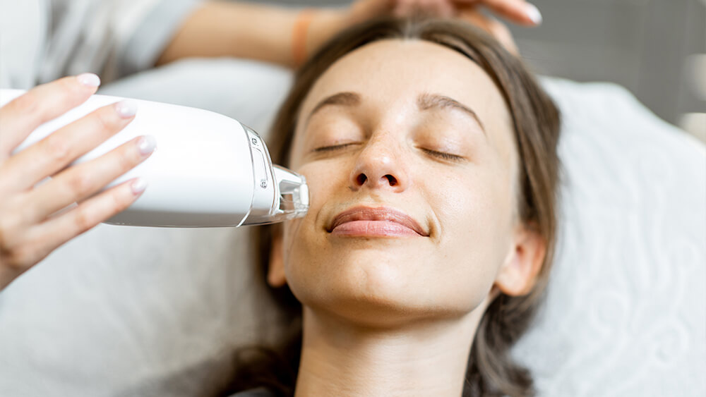 Woman during a laser rejuvenation treatment