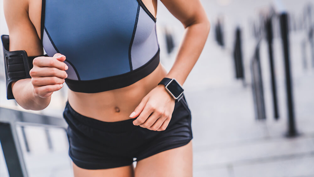 Shot of female tracksuit with wristwatch