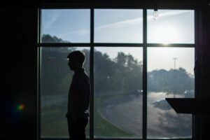 man waiting for addiction treatment bed