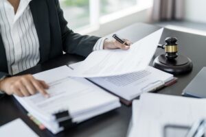Truck accident lawyer in Van Nuys filing out paperwork for settlement in Van Nuys, CA